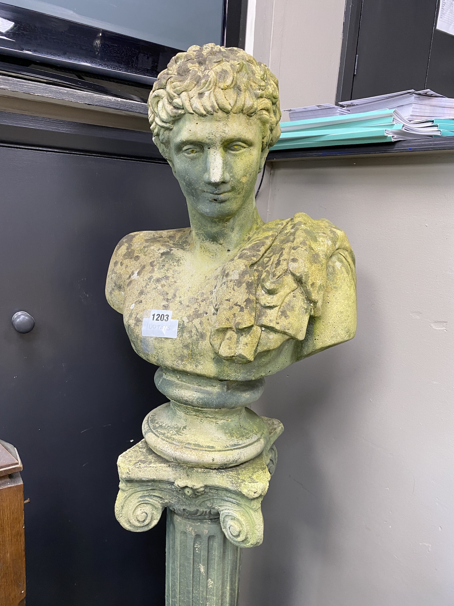 A reconstituted stone classical garden bust on ionic column, height 152cm